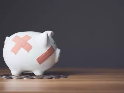 Empty piggy bank to show cut budgets