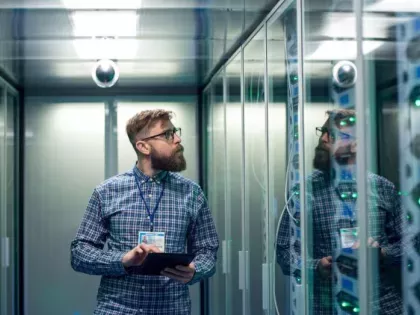 digital infrastructure, IT worker in a server room